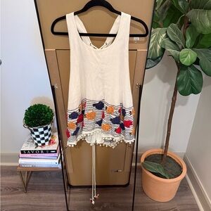 Embroidered Sleeveless Top with Pom Pom Hem